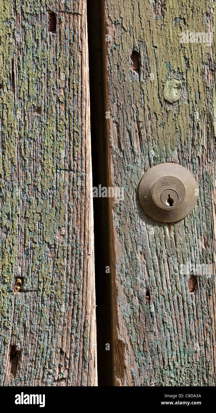 Door Lock on a Weathered Green Wood Door Stock Photo - Alamy
