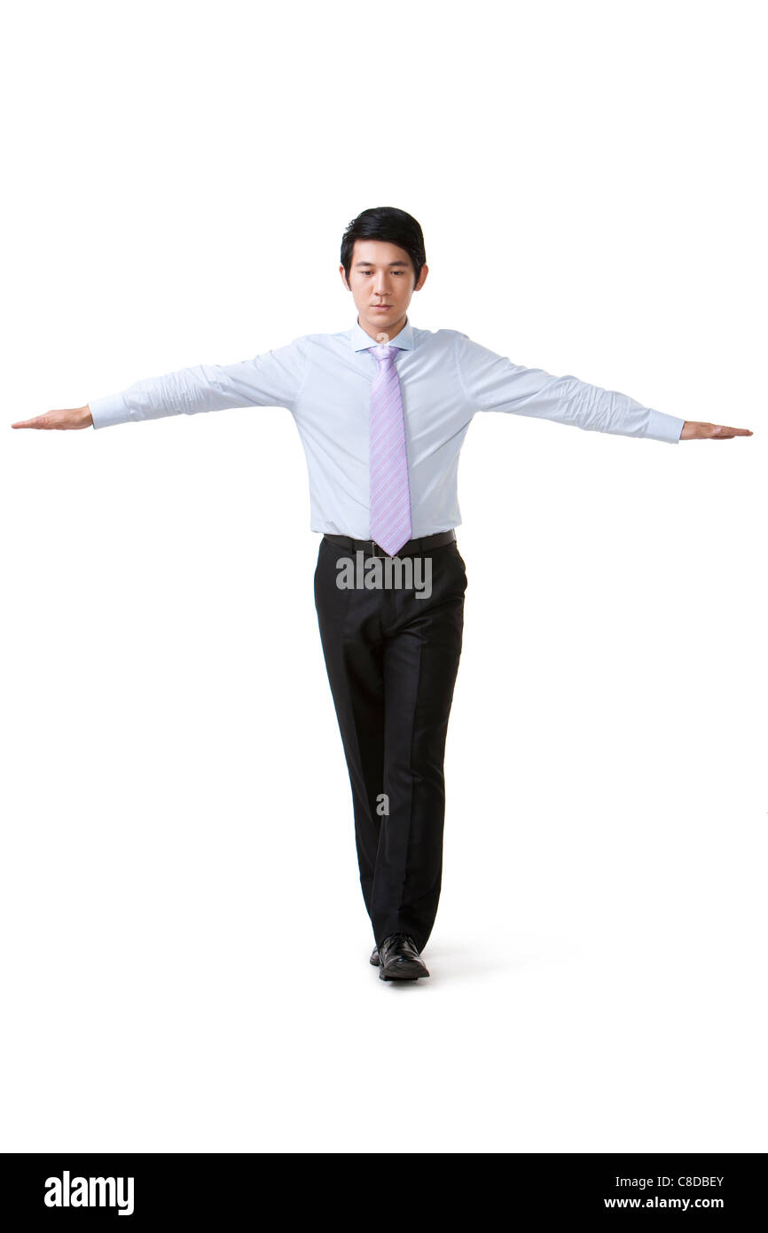 Businessman Walking in a Straight Line, Balanced Stock Photo