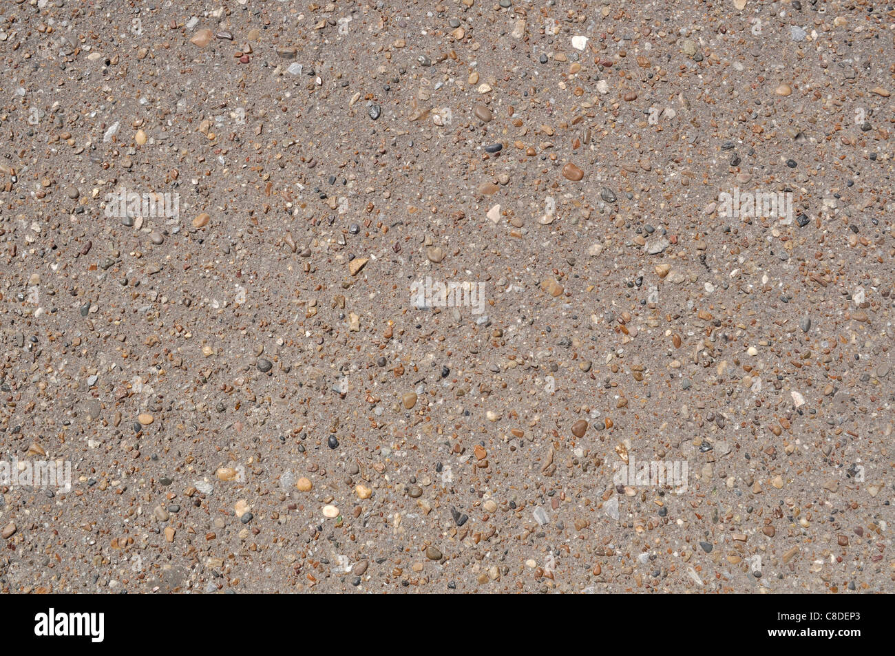 The surface of decorative asphalt inlaid with colored stones Stock ...