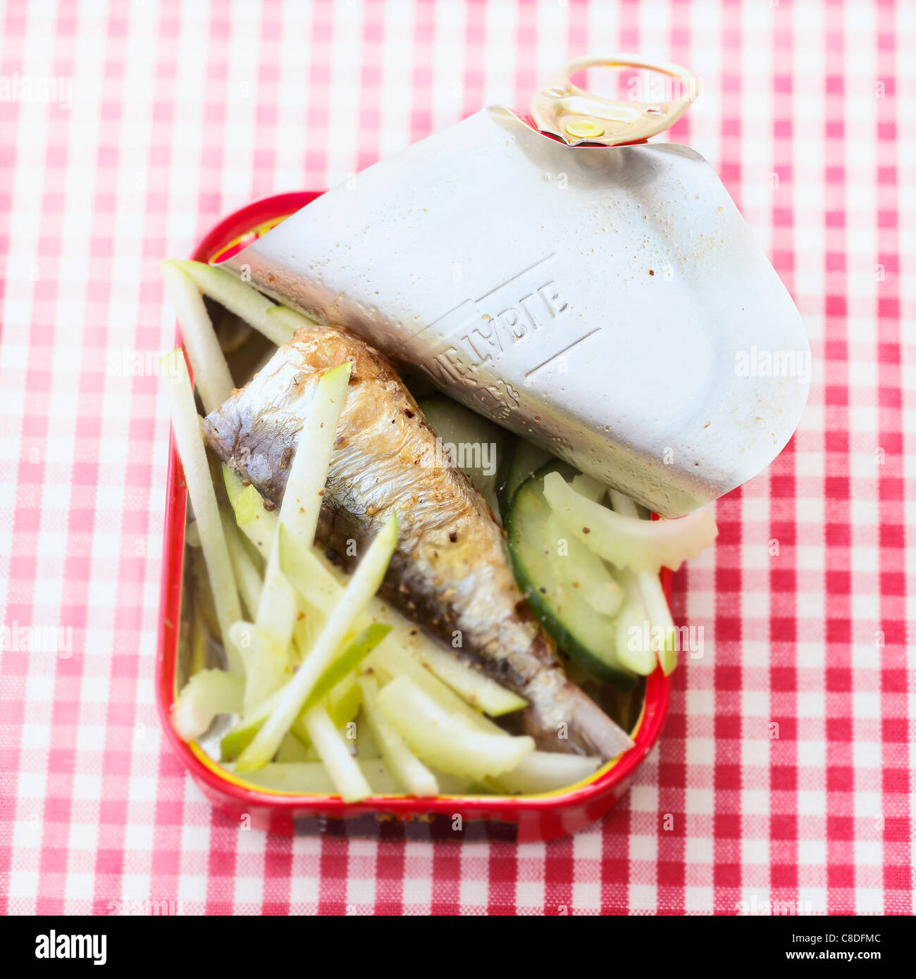 Canned sardine ,apple,celery and cucumber salad served in it's tin