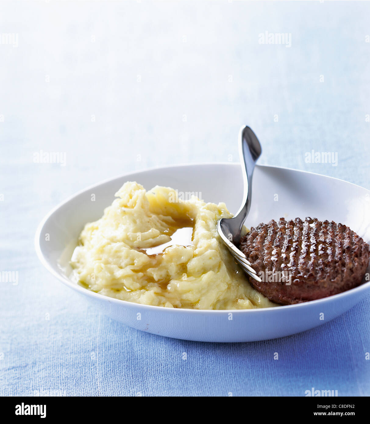 Hamburger steak with gravy and mashed potatoes Stock Photo - Alamy