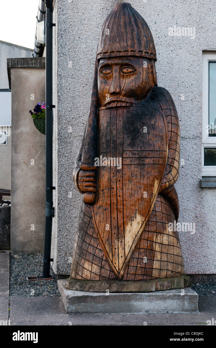 Copy of a carved wooden 'Berserker' Rook from the Lewis chess set at Crowlista near Traigh Uige where the set was found. Stock Photo