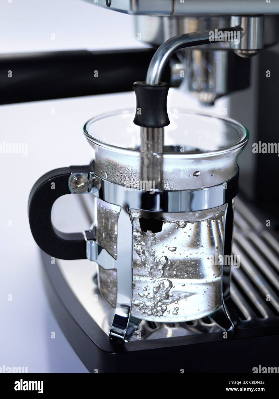 Heating a cup of water Stock Photo Alamy