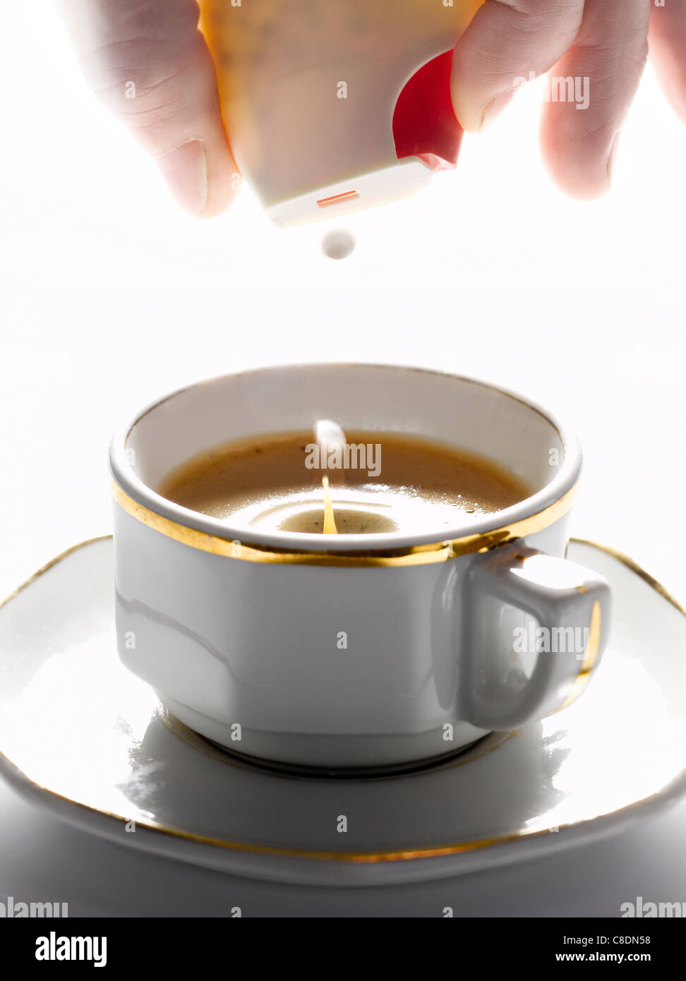 Adding sweetener hi-res stock photography and images - Alamy