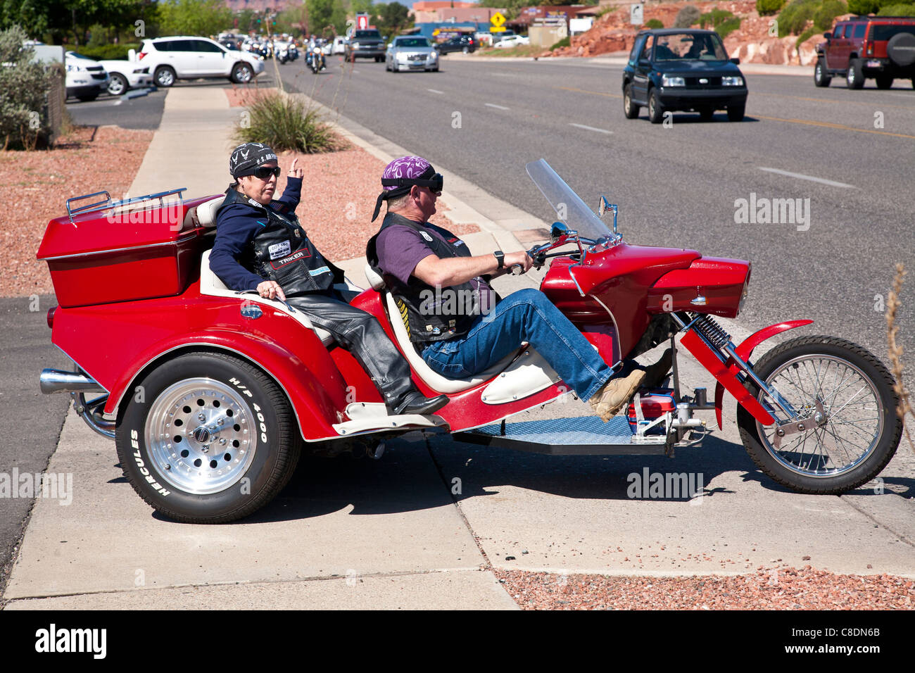 Couple riding a trike Stock Photo