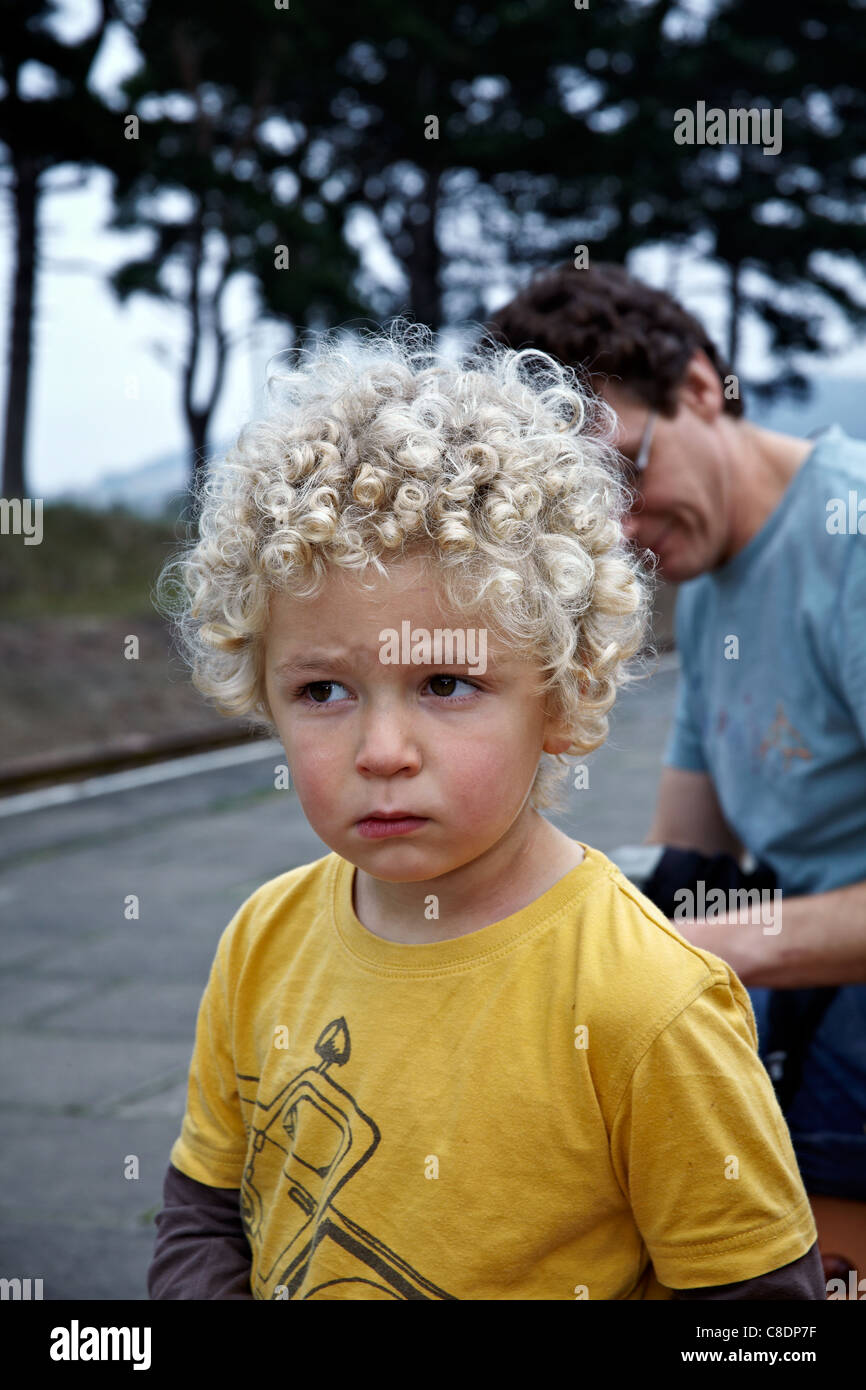 Boy Curly Hair Young Boy Sporting A Mass Of Naturally Blonde Curly Stock Photo Alamy