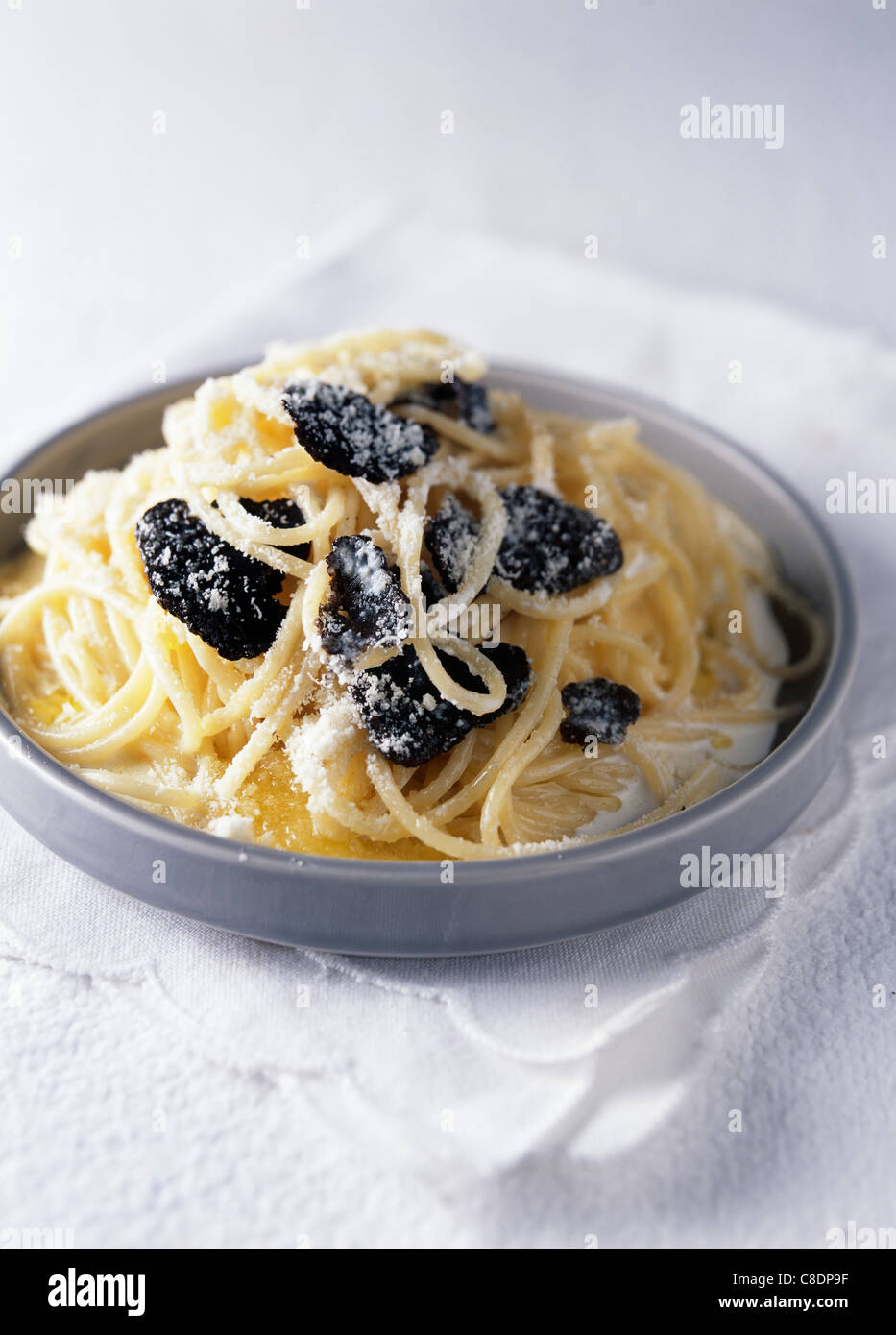 Spaghettinis with black and white truffles Stock Photo