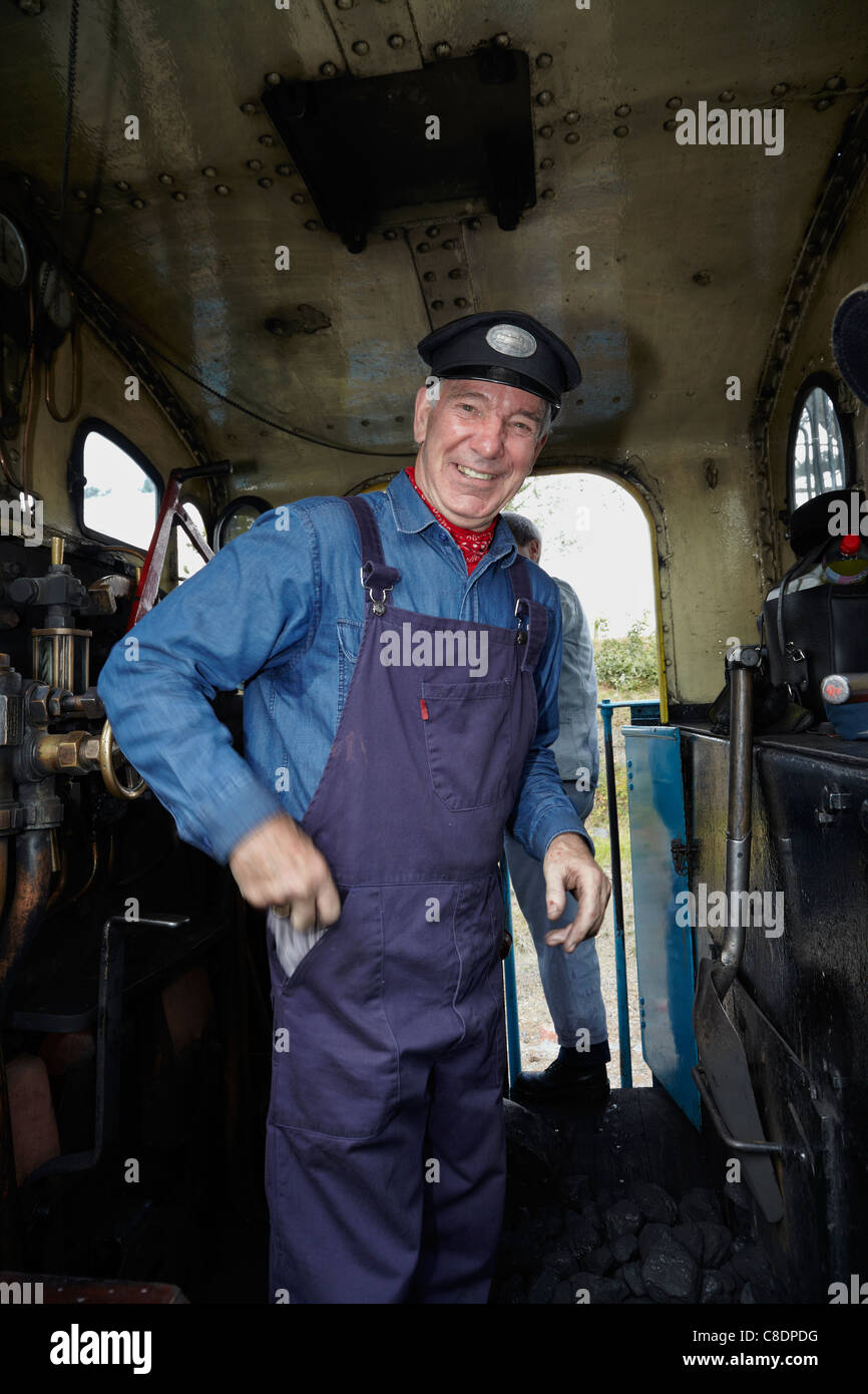 Portrait of an English steam train driver at work Stock Photo Alamy