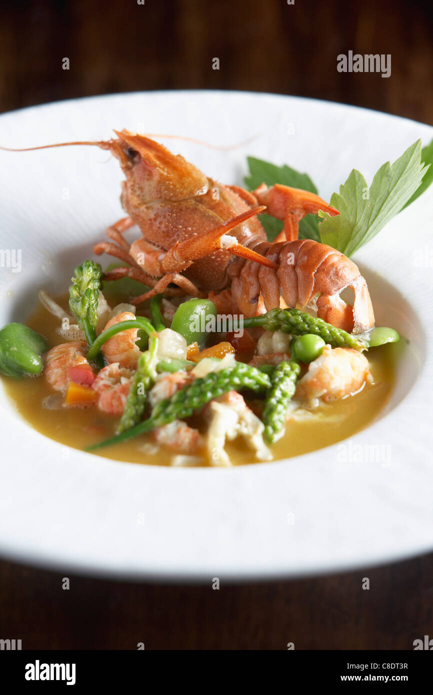 Crayfish and green vegetable Nage Stock Photo