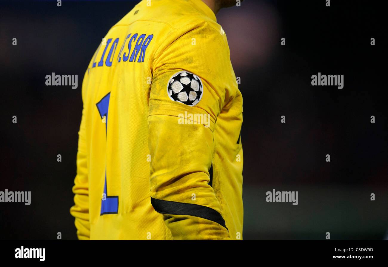 UEFA Champions league badge on the yellow goalkeeper shirt of Julio Cesar of Inter Milan Stock Photo