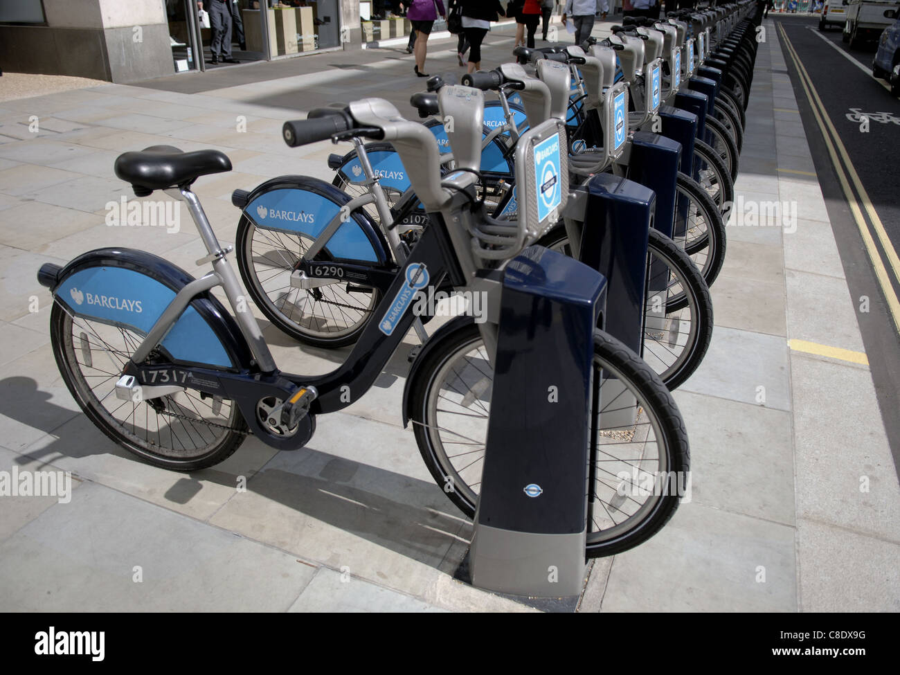 Bicycles for hire in the City Of London. To try to help with traffic congestion, these can be hired very cheaply by the public. Stock Photo
