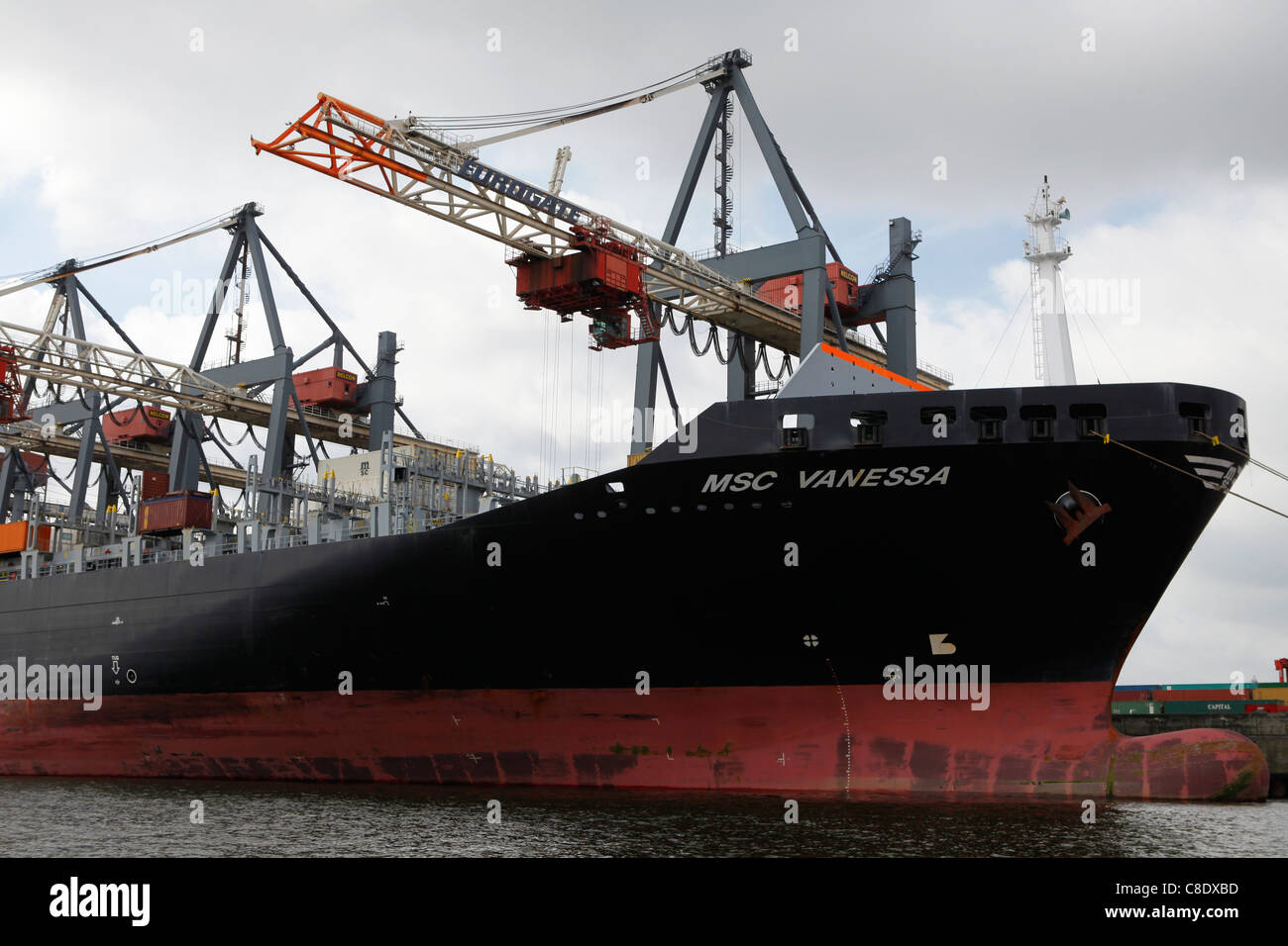 Unloading at a container terminal in the docks of Hamburg, Germany ...