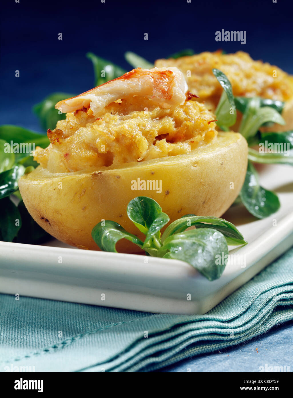 Baked potato stuffed with crab Stock Photo Alamy