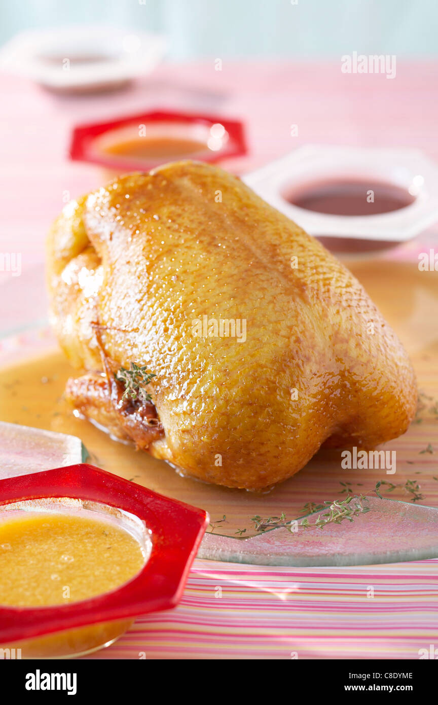 Whole roast duck with sauces Stock Photo - Alamy