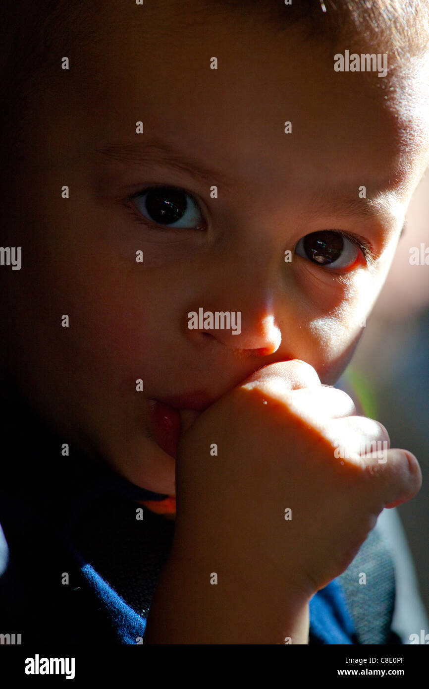Little boy sucking his thumb Stock Photo
