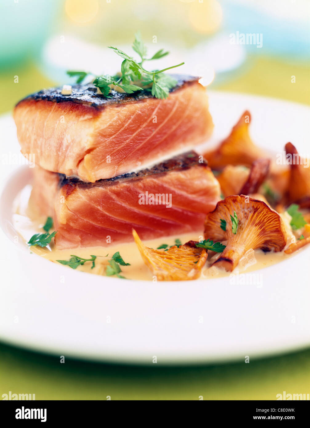 Thick pieces of grilled salmon with chanterelles Stock Photo Alamy