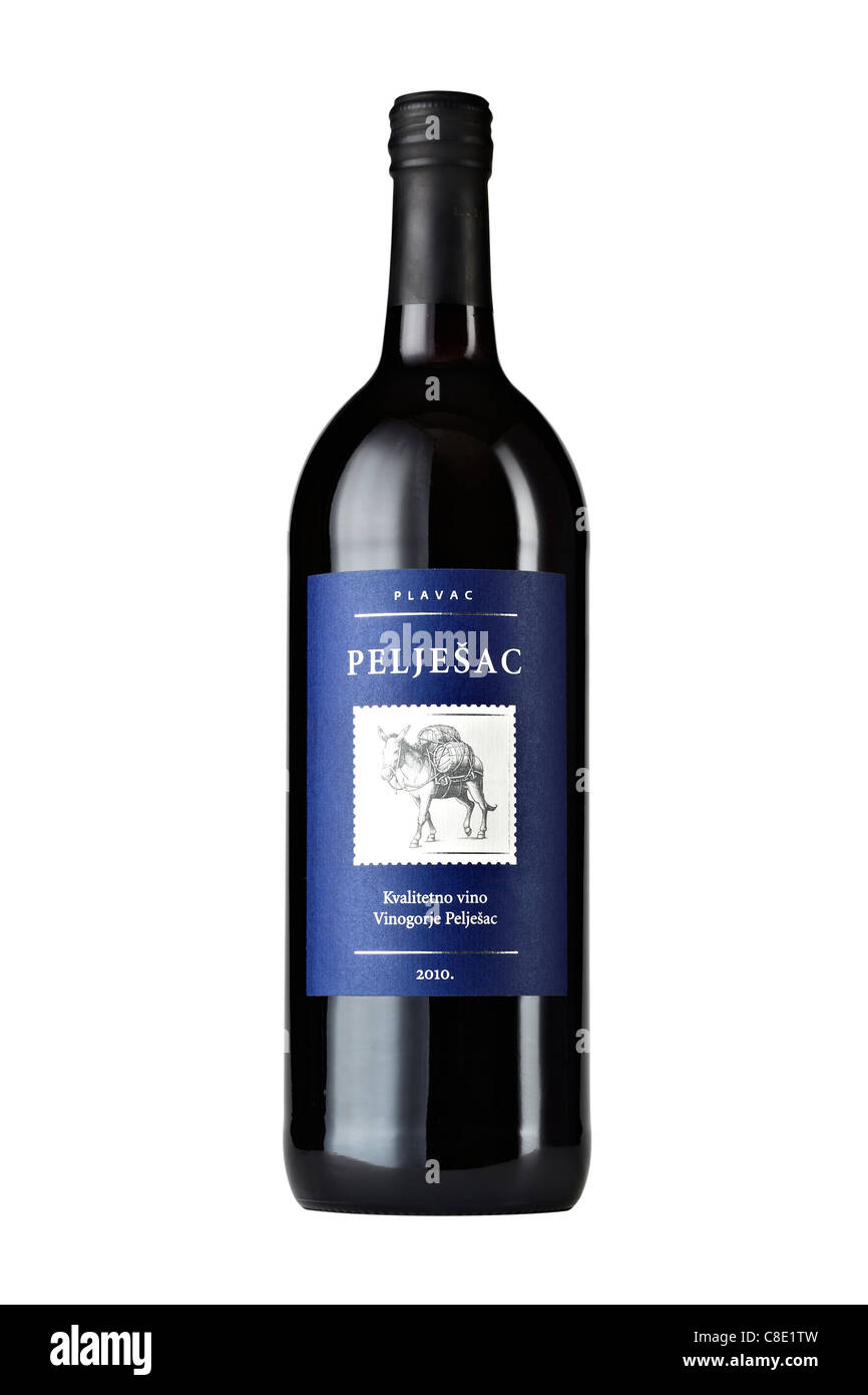 Peljesac red, dry wine bottle with label showing donkey carrying barrels, Peljesac peninsula, Croatia Stock Photo