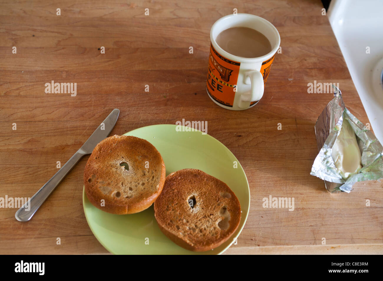 A bagel, cream cheese and coffee for breakfast Stock Photo