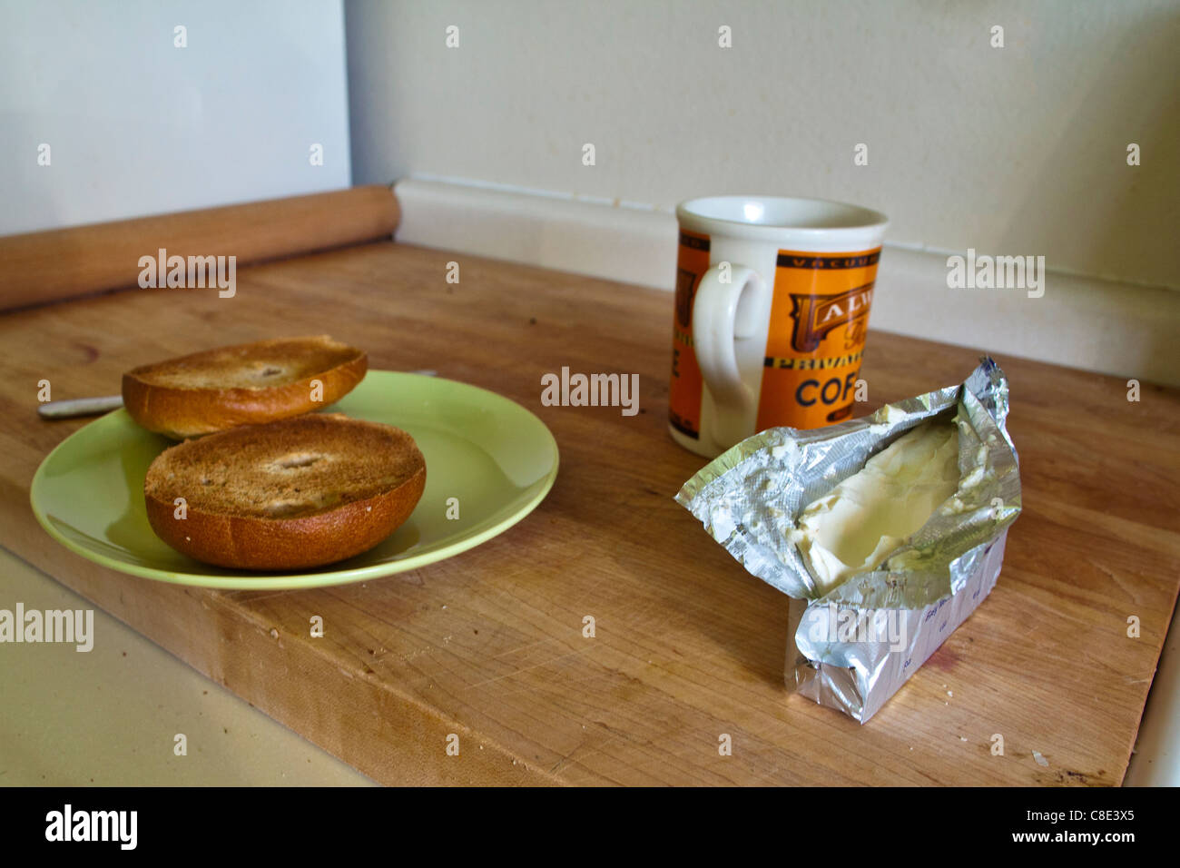 A bagel, cream cheese and coffee for breakfast Stock Photo