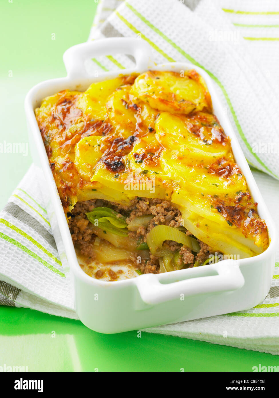 Leek,potato and minced beef cheese-topped dish Stock Photo