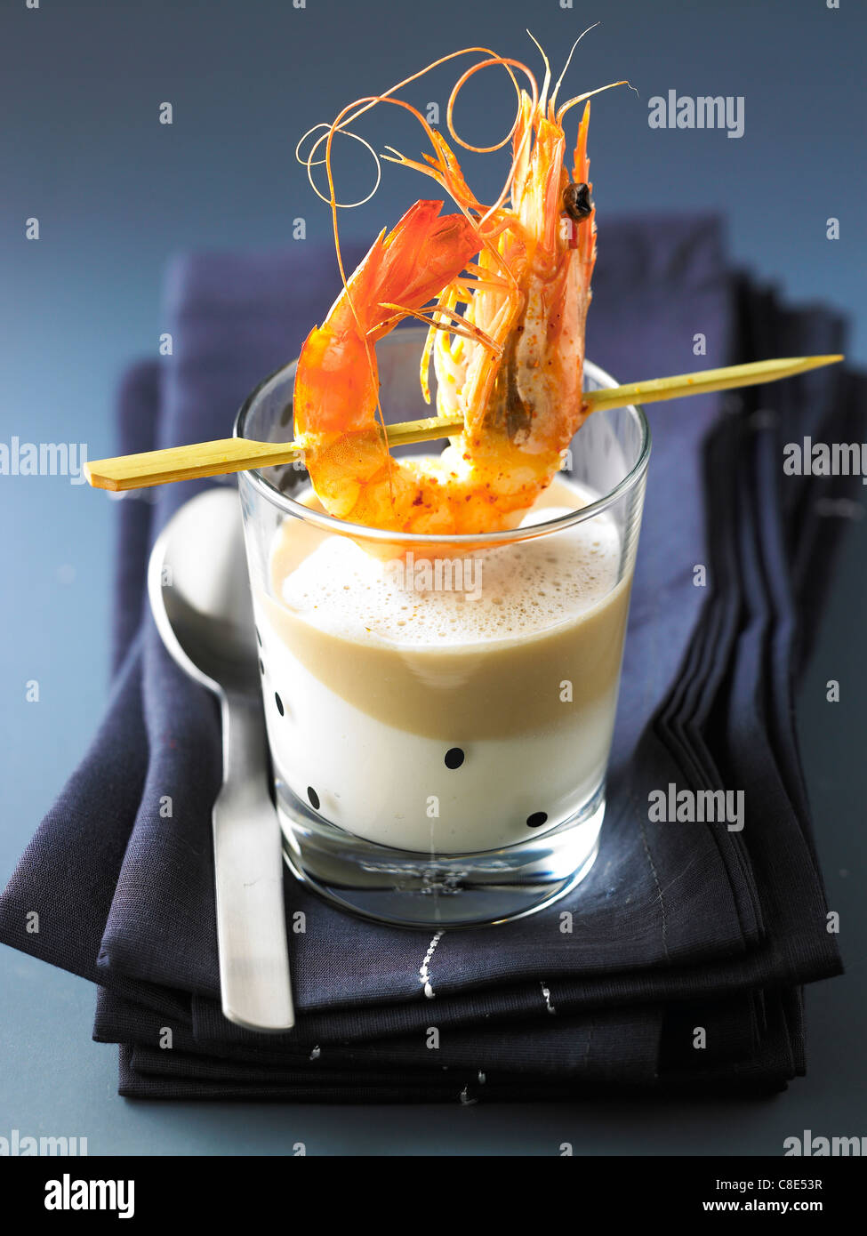 Cream of parsnip,chestnut emulsion and grilled gambas Stock Photo