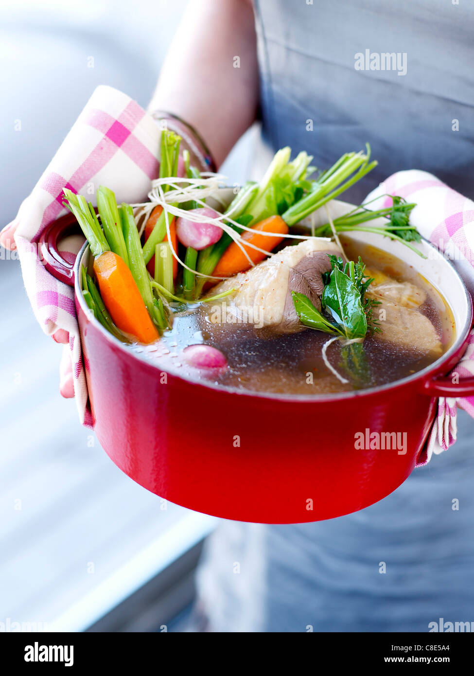 Stringed roast beef with vegetables in a casserole dish Stock Photo