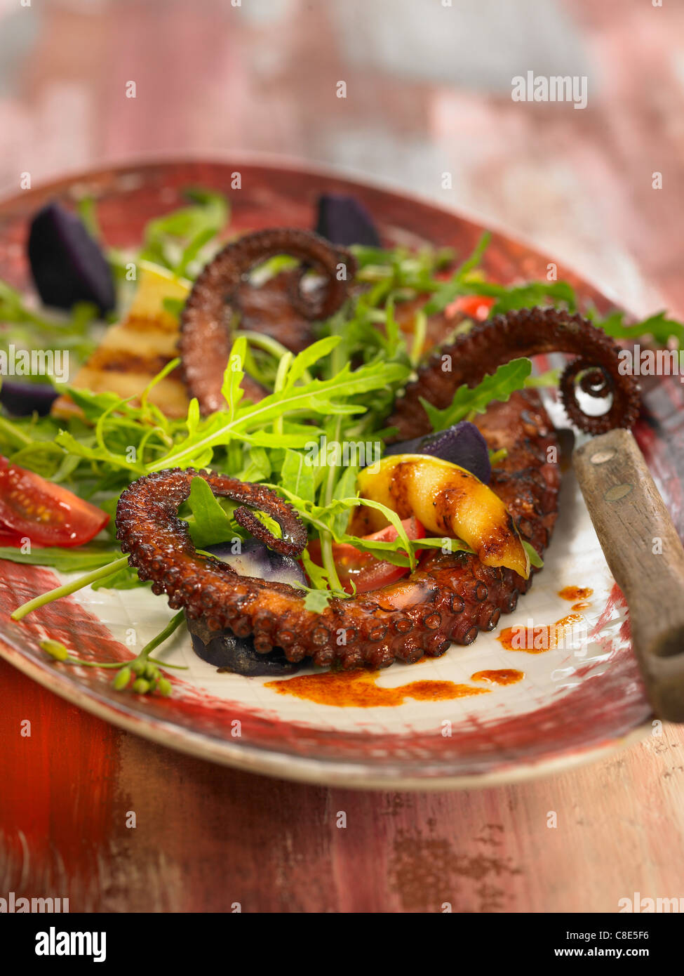 Octopus,lamb's lettuce,purple potato and apple salad Stock Photo