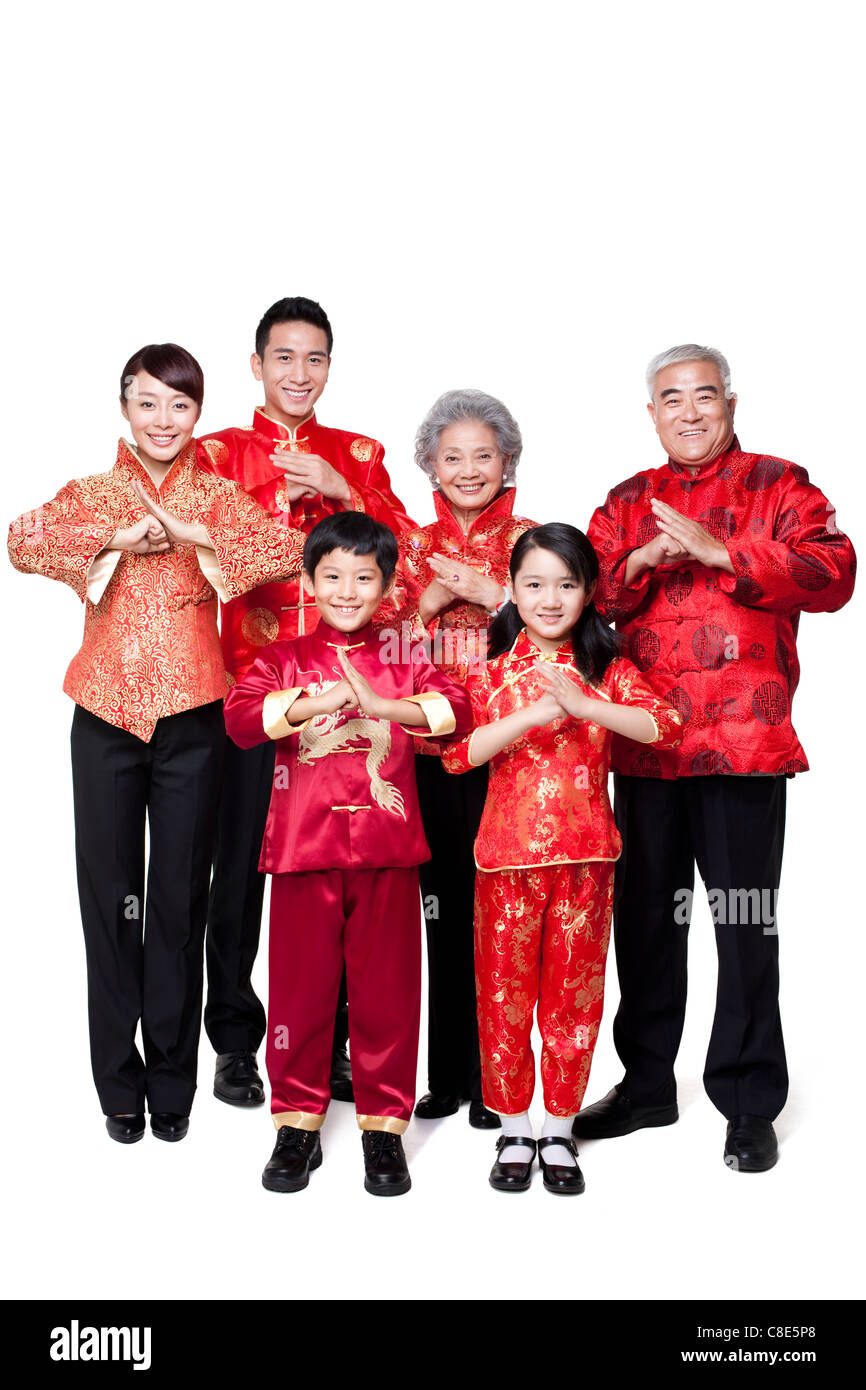 Family Dressed in Traditional Clothing  Celebrating Chinese New Year Stock Photo