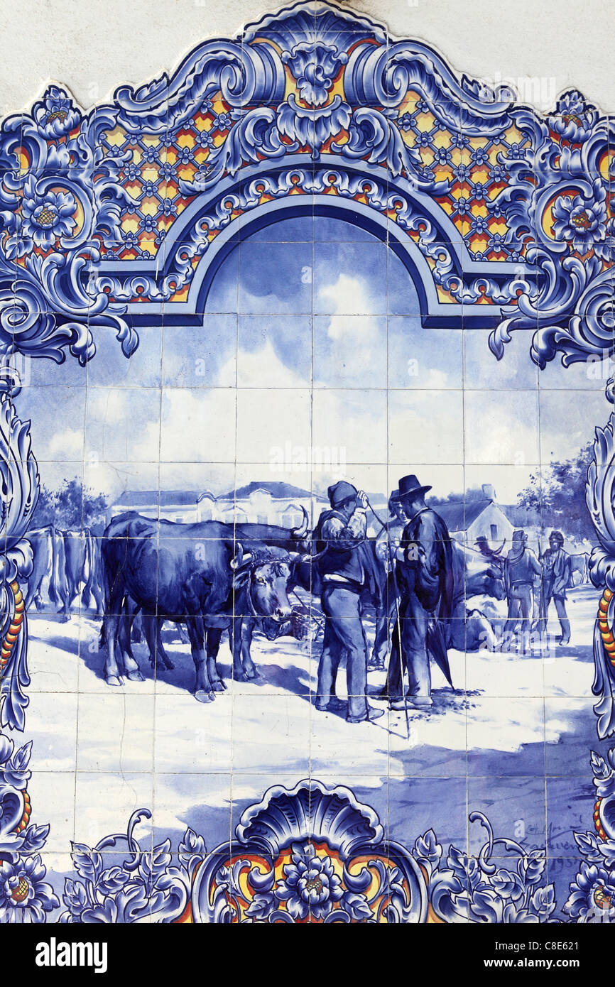 Traditional painted tiles (Azulejos) show rural scene at the city market in Santarem, Ribatejo, Portugal Stock Photo