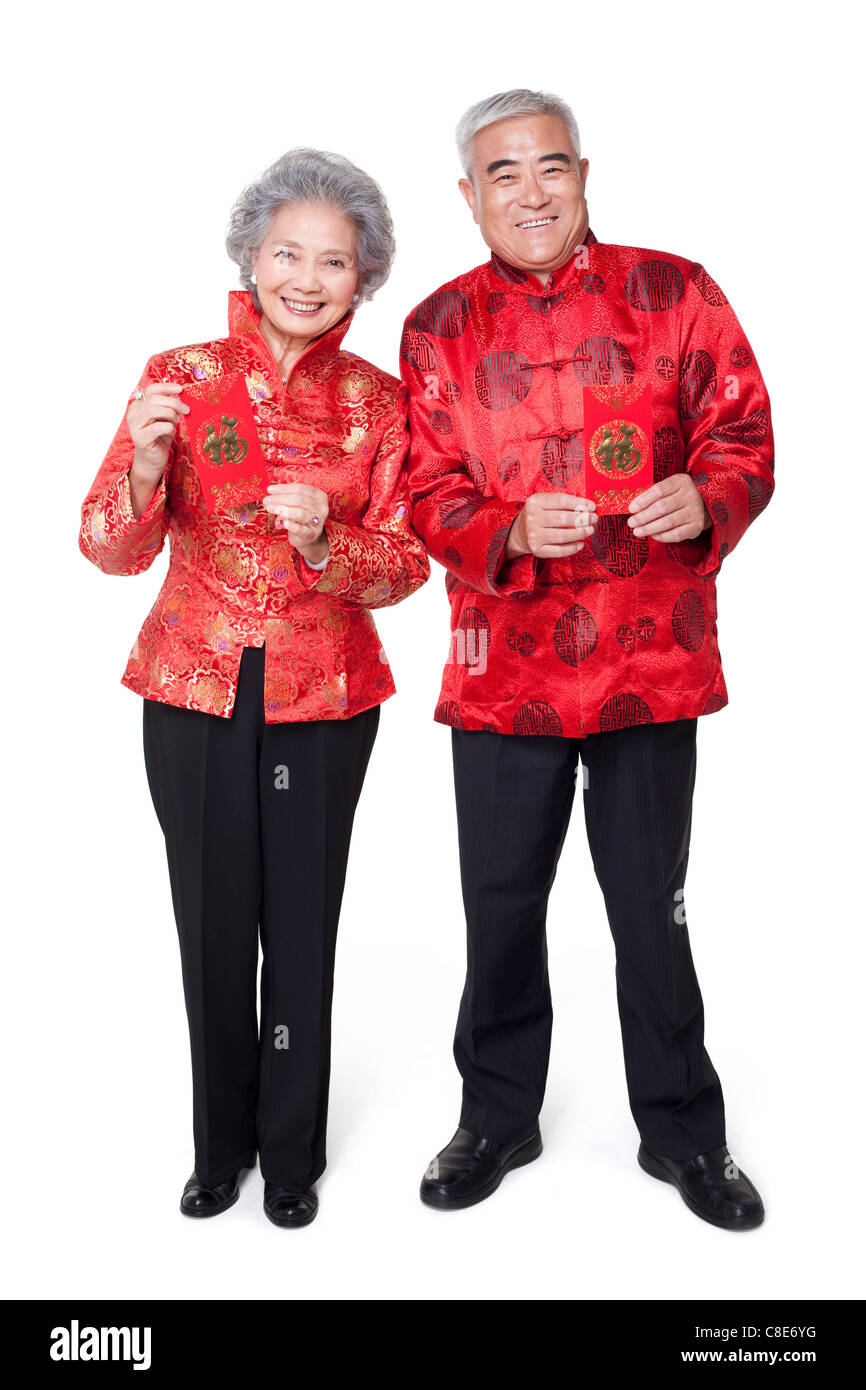 Senior Couple Dressed in Traditional Clothing Celebrating Chinese New ...