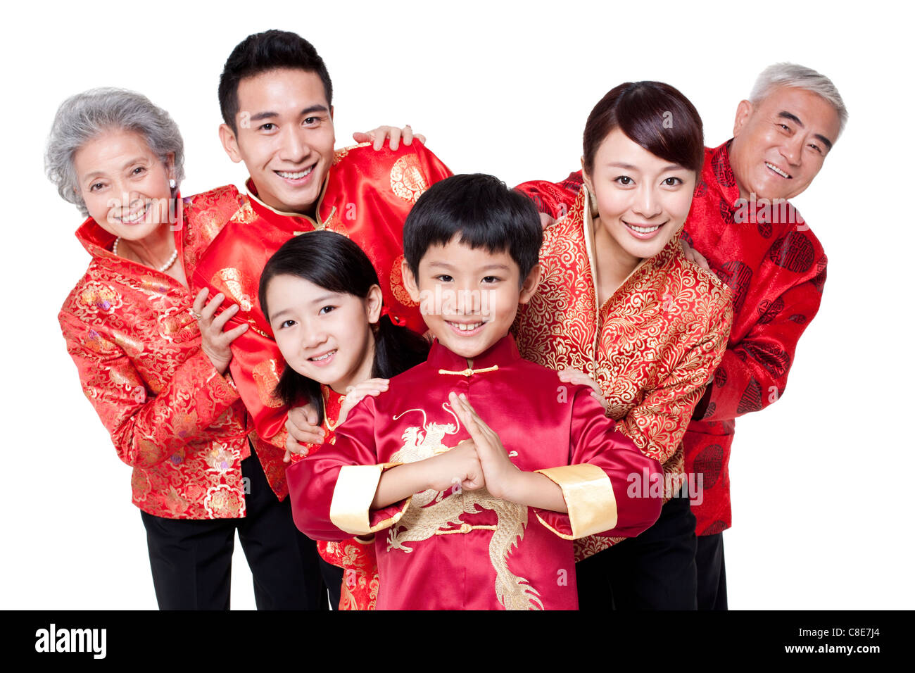 Family Dressed in Traditional Clothing  Celebrating Chinese New Year Stock Photo