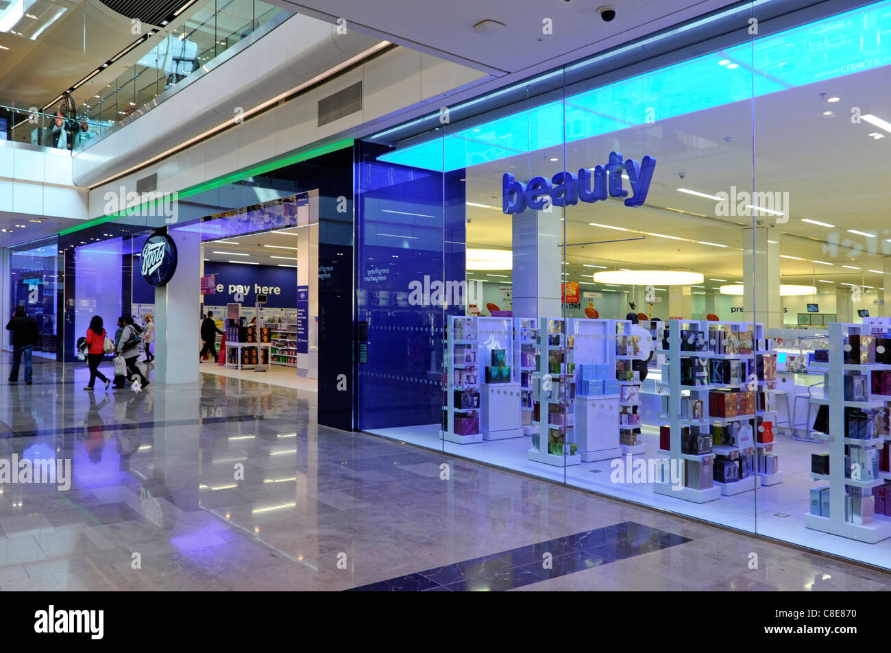 People in Boots pharmacy chemist beauty shop front & window in Westfield shopping centre mall in Stratford City East London newham England UK Stock Photo