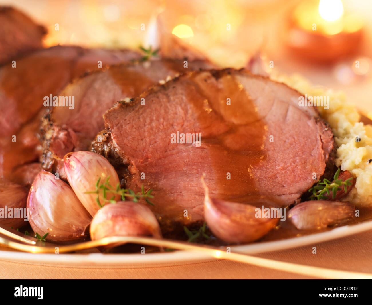 Leg of lamb with garlic Stock Photo Alamy