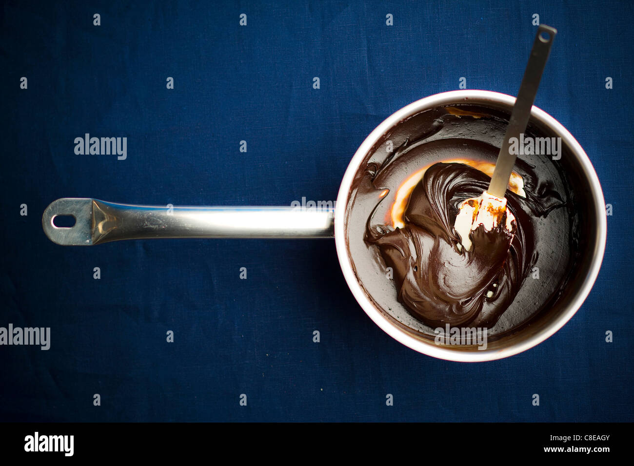 Saucepan of melted chocolate Stock Photo