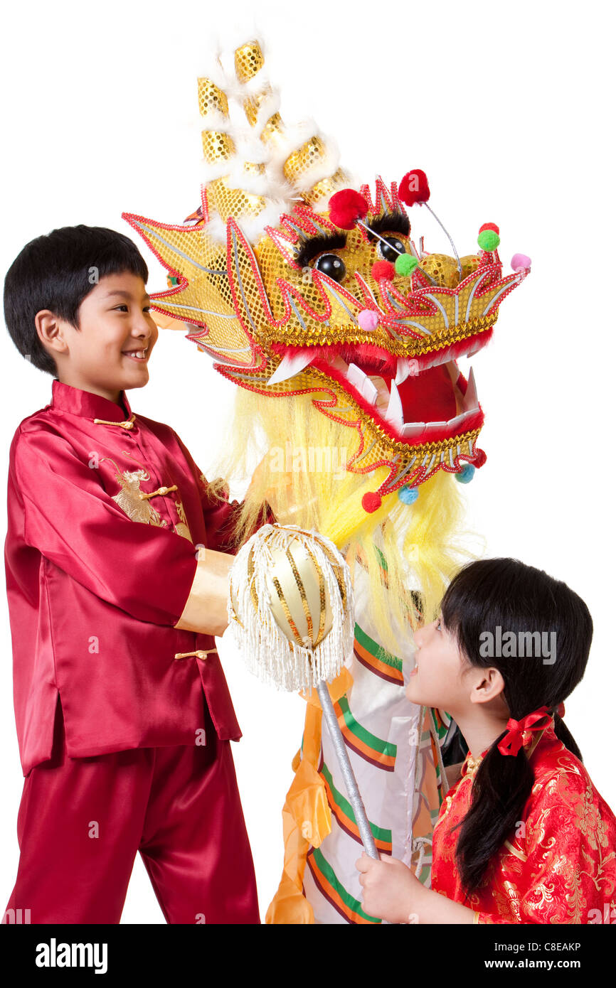 Boy and Girl Dressed in Traditional Clothing Celebrating Chinese New Year Stock Photo