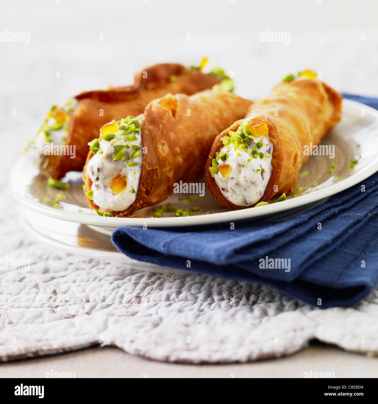 Sicilian Cannolis with ricotta,chocolate,pistachio and crystallized orange filling Stock Photo