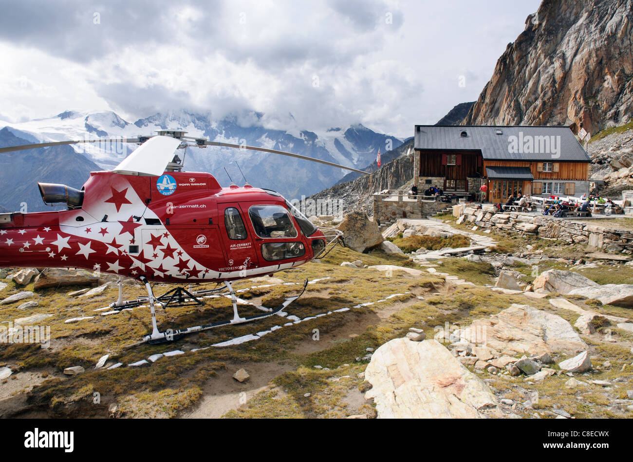 A rescue helicopter at the Almageller Hut in the Swiss Alps Stock Photo
