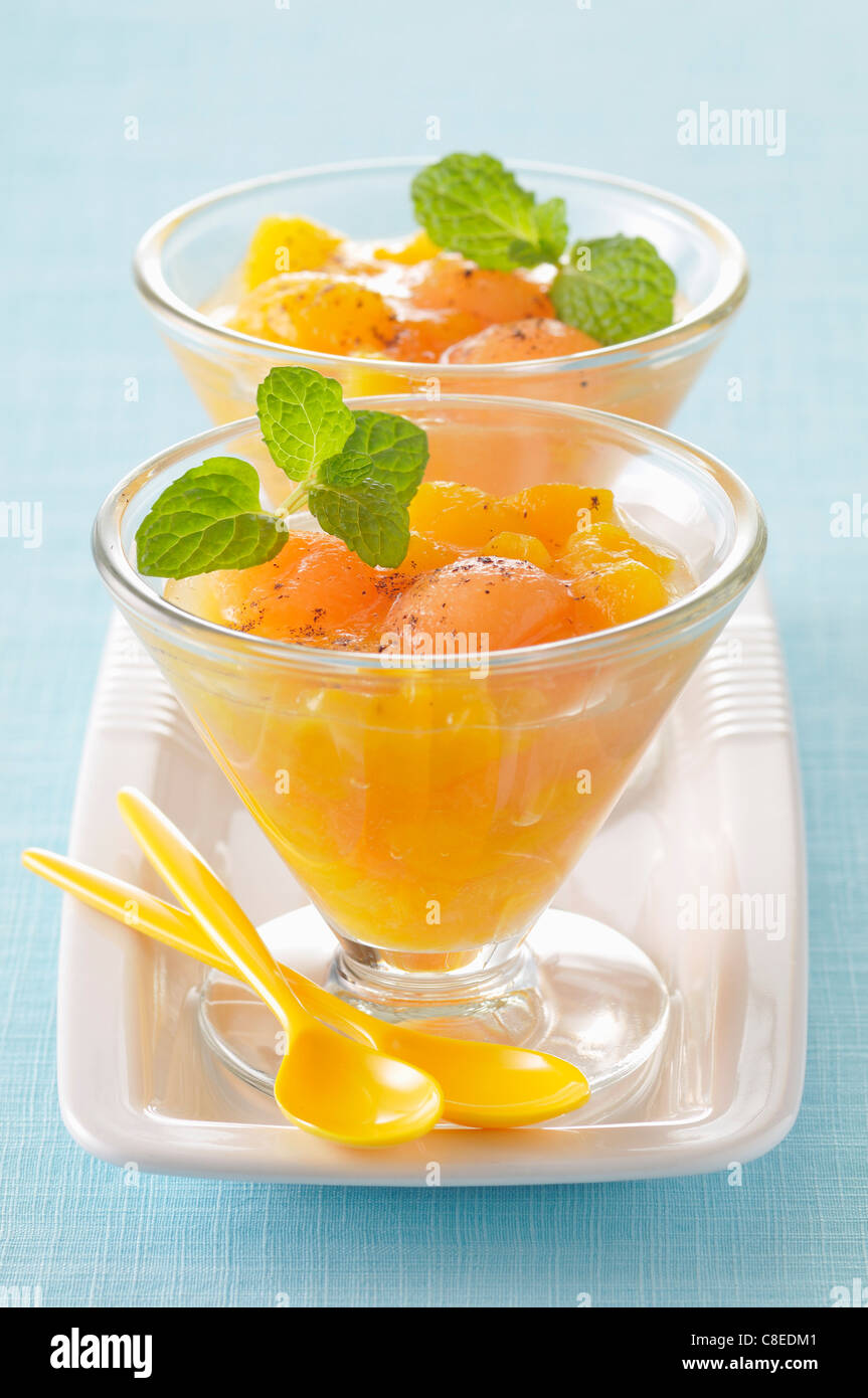 Peach,pear and melon fruit salad with Muscat Stock Photo