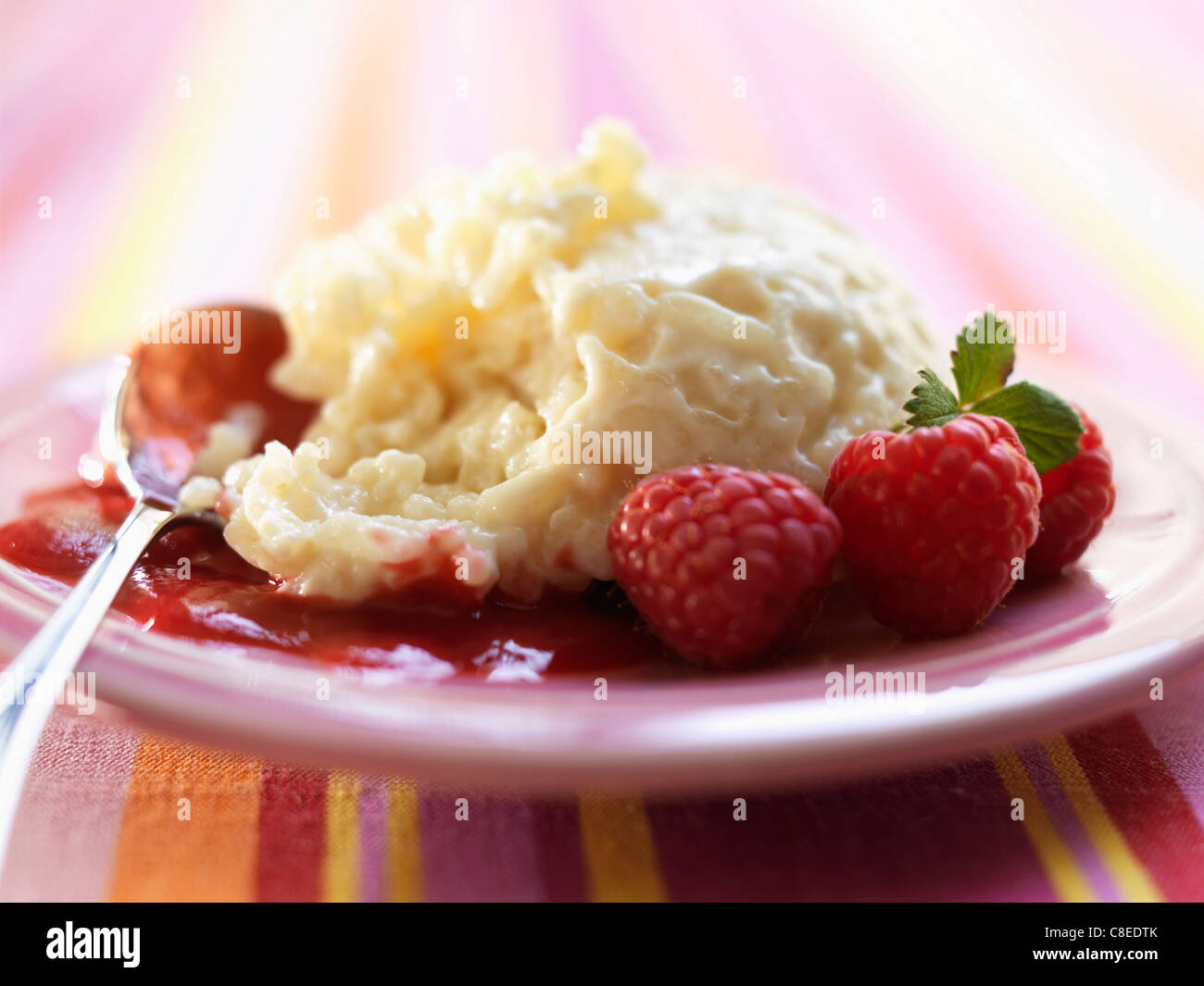 Rice pudding with raspberries Stock Photo - Alamy