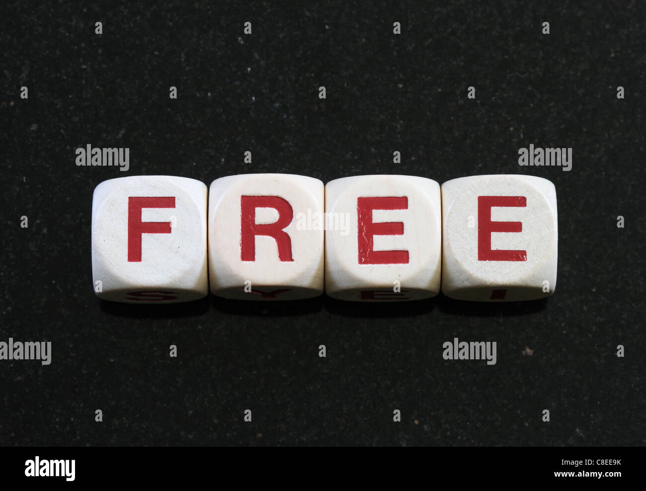 free spelled out in letter blocks with dark background Stock Photo