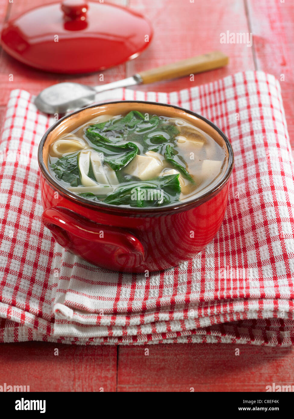 Fideos, tofu and spinach soup Stock Photo
