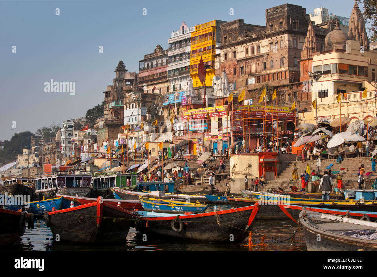 Tourist boats in The Ganges River at Dashashwamedh Ghat to watch Hindus bathing in Holy City of Varanasi, Benares, India Stock Photo