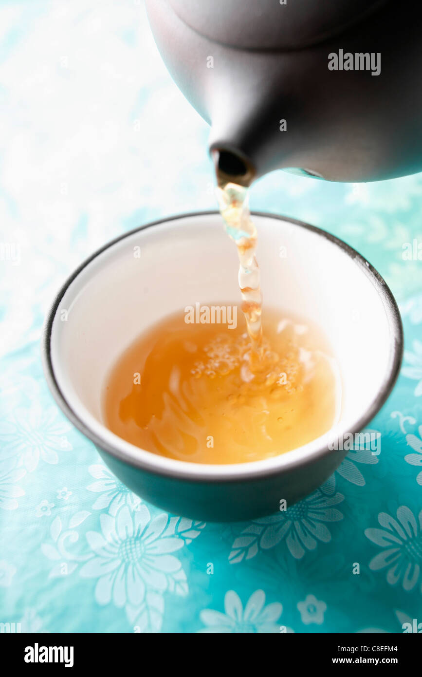 Pouring a cup of tea Stock Photo