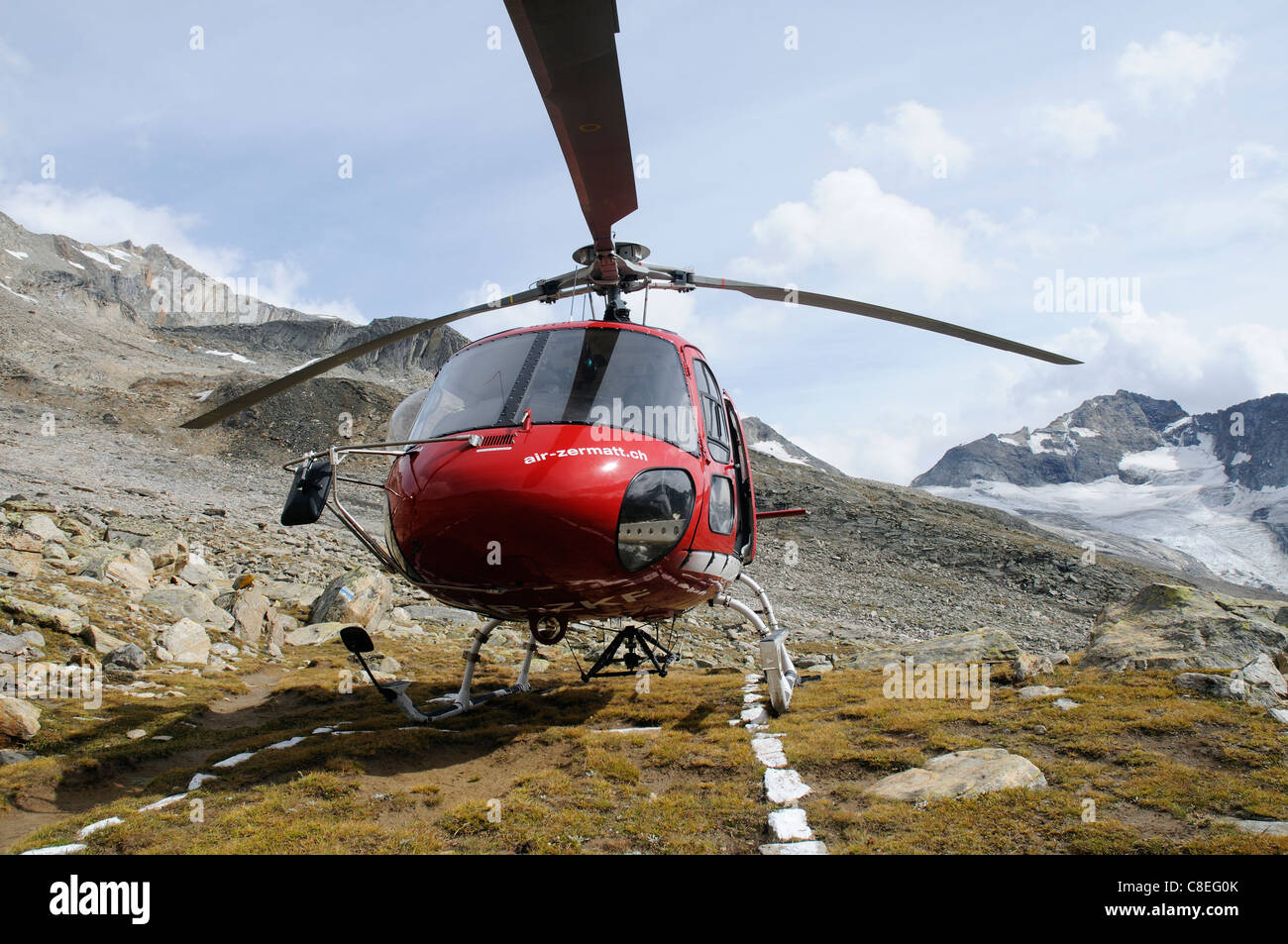 A rescue helicopter in the Swiss Alps Stock Photo