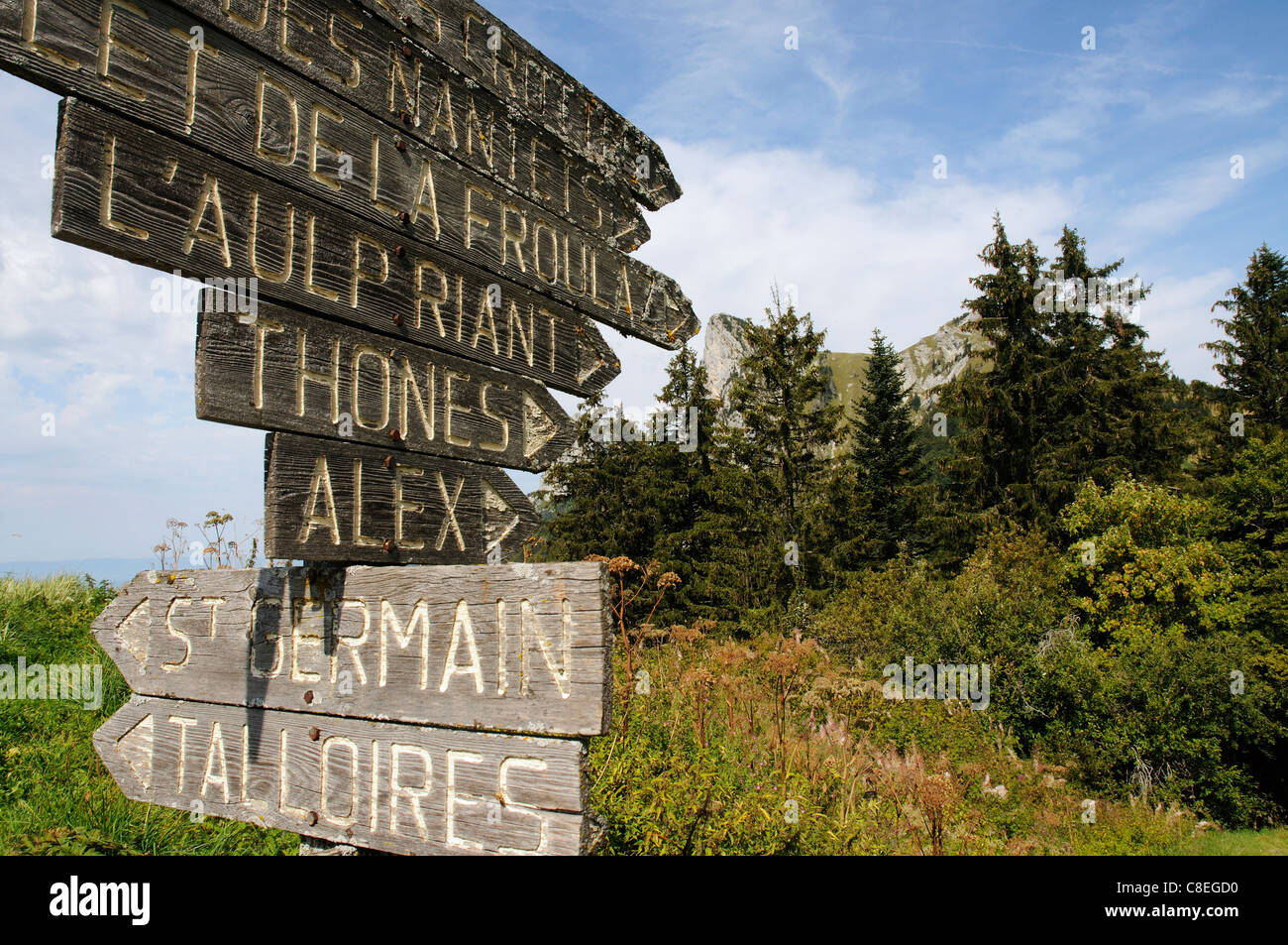 An old wooden signpost in the French Alps Stock Photo