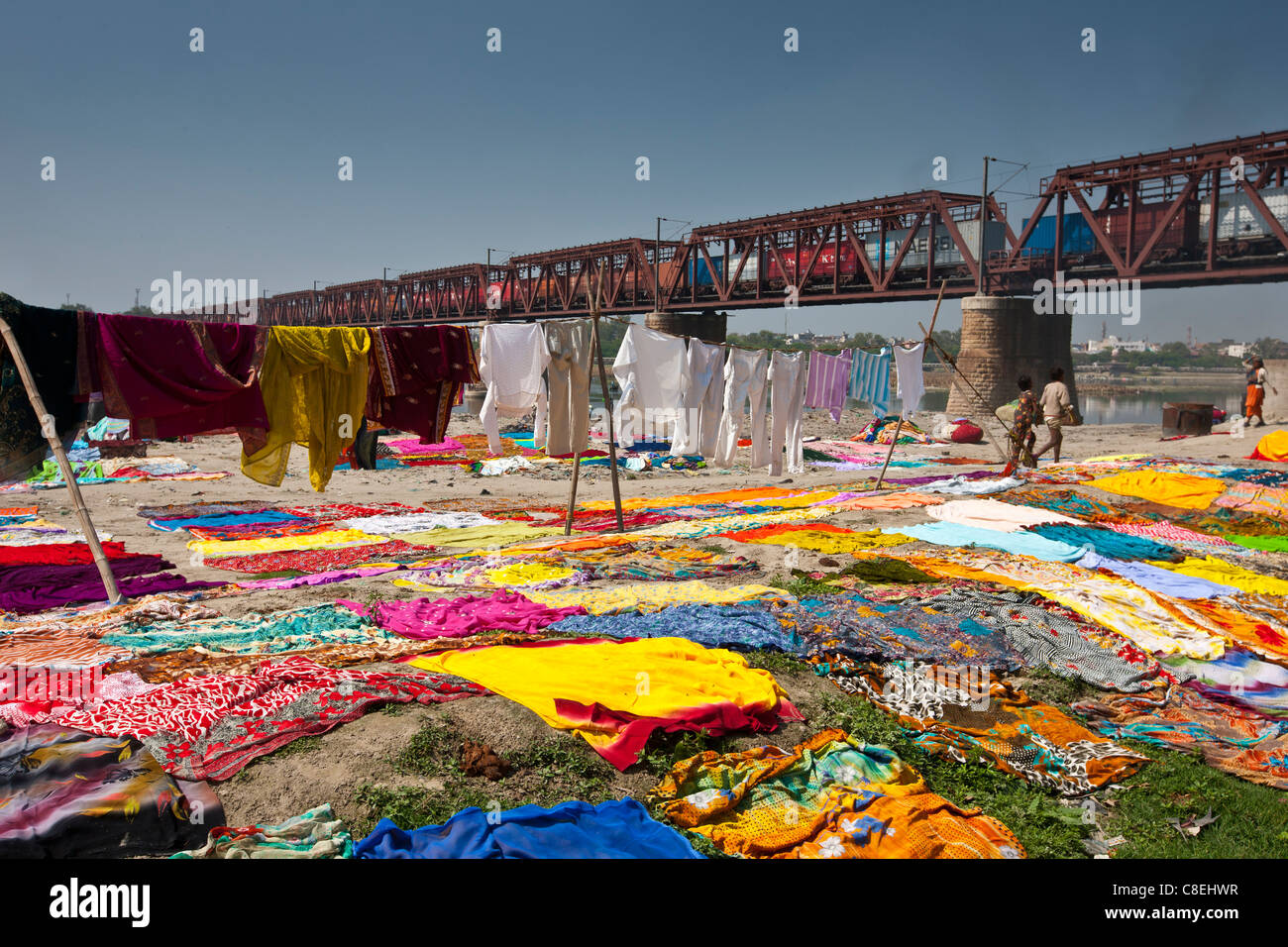 Saris and other laundry drying on the banks of River Yamuna at Agra, India Stock Photo
