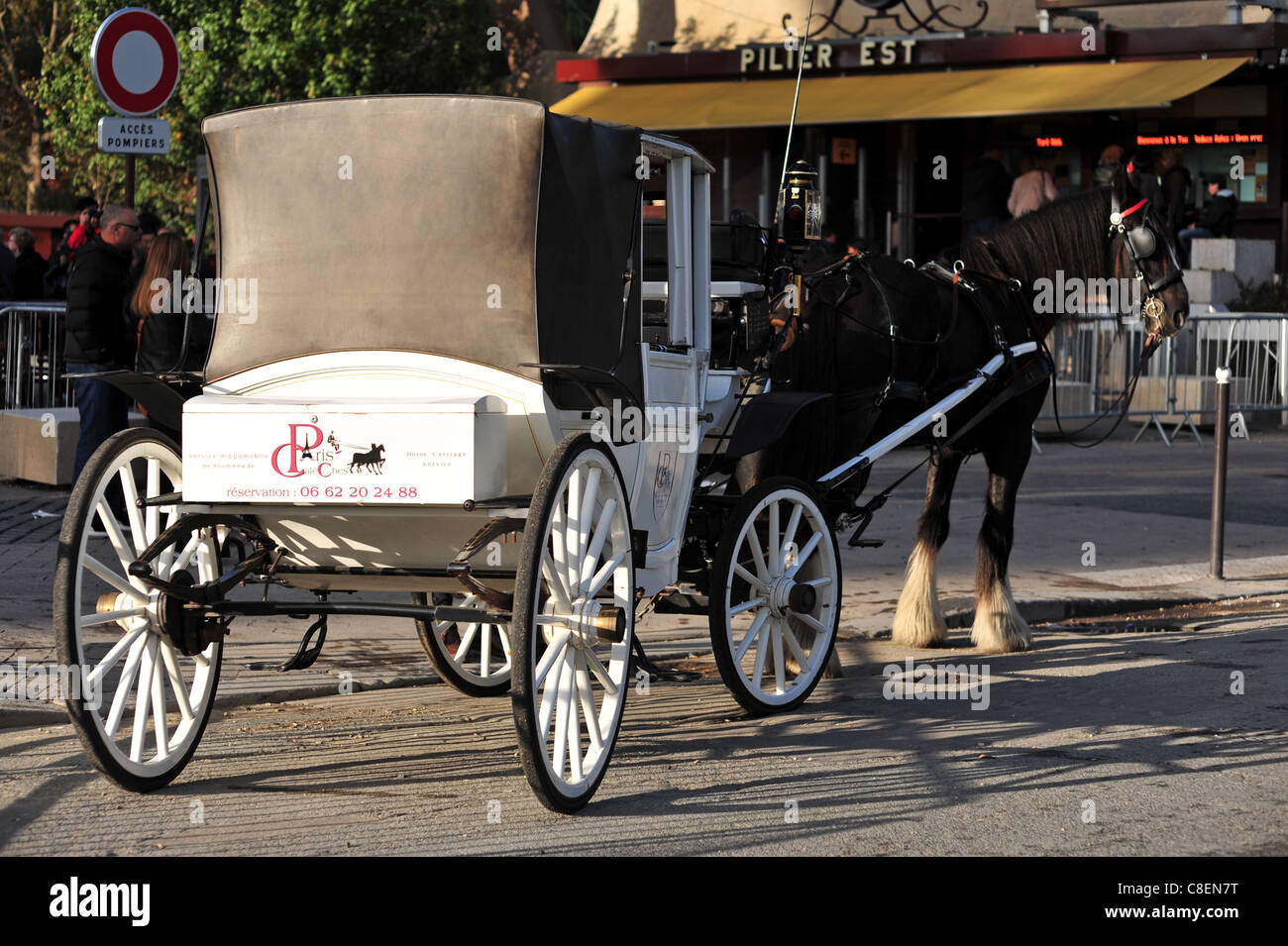 Paris Europe France, near Eiffel Tower, Tour Eiffel, white carriage with horse for tourists  at dusk Stock Photo