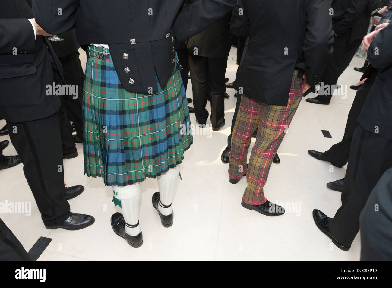 Tartan kilt and trousers as worn at a formal event by men of Scottish heritage. Stock Photo