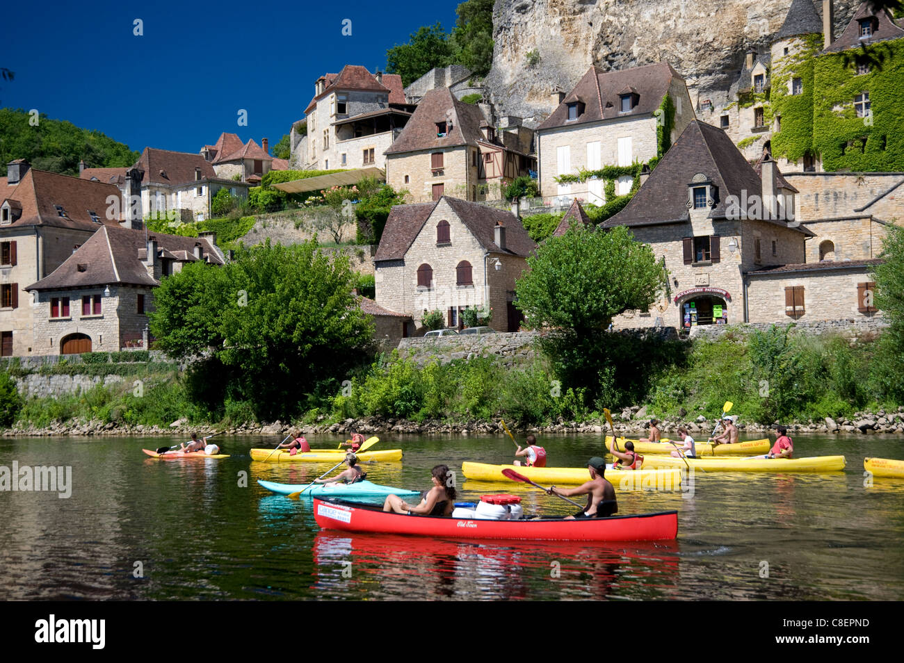 People in canoes on the Dordogne River near La Roque-Gageac, Dordogne, France Stock Photo
