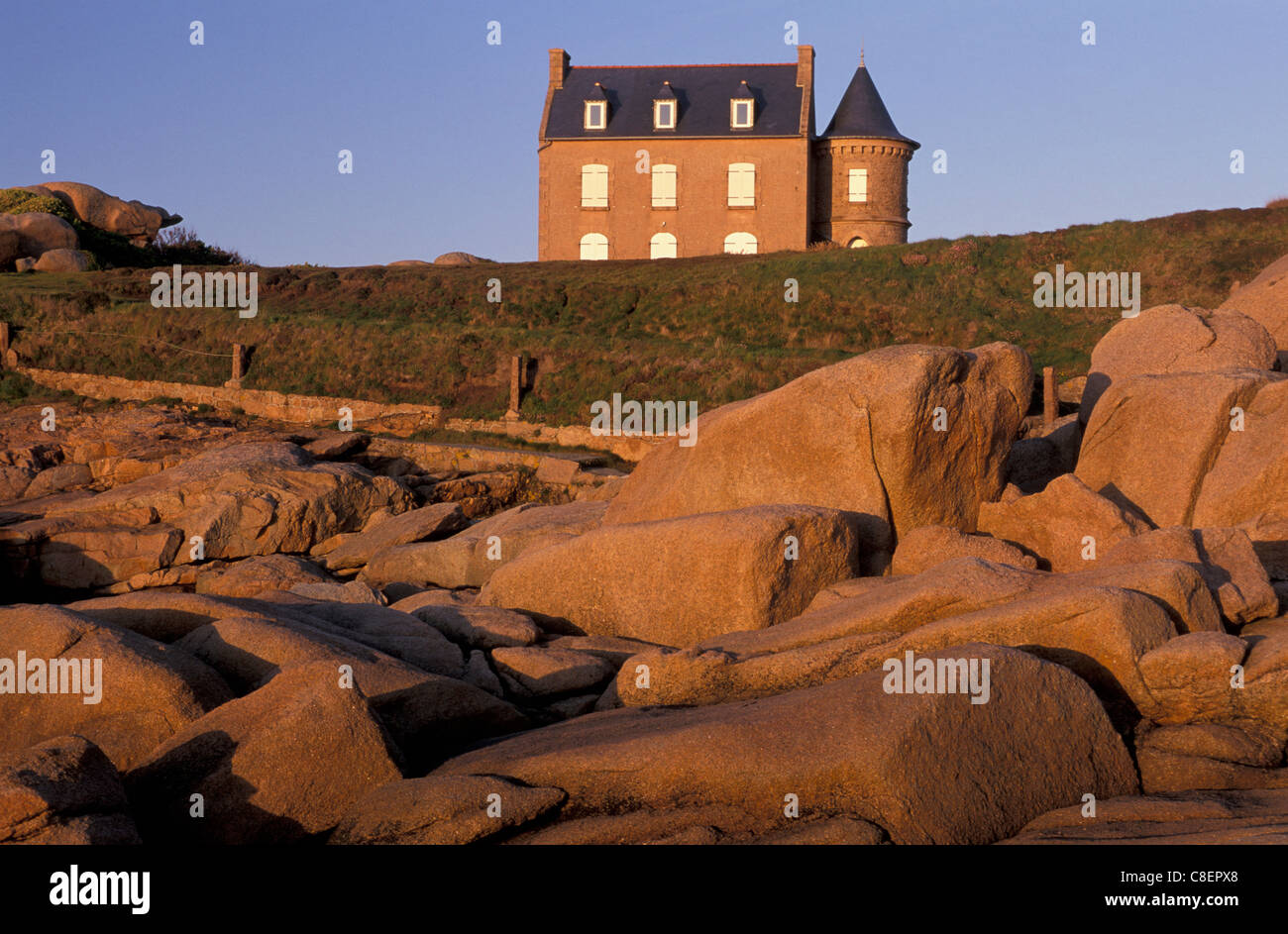 House, Red Rocks, Evening light, Ploumanach, Brittany, France, Europe, Stock Photo